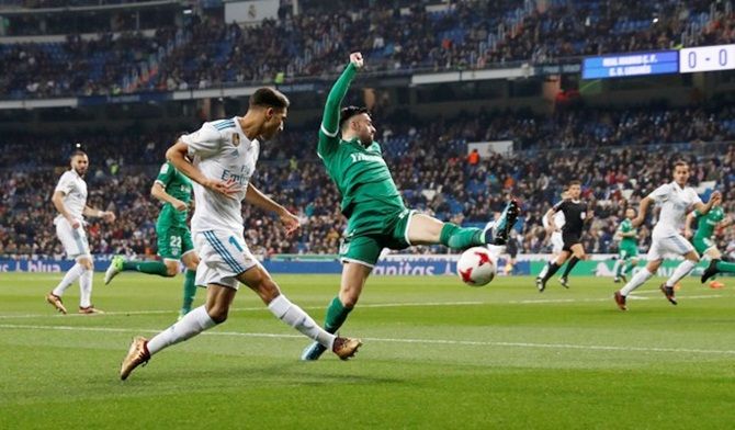 Leganes's Diego Rico attempts to cut off a cross from Real Madrid’s Achraf Hakimi.