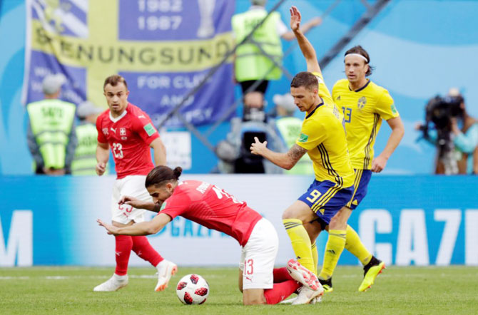 Sweden's Marcus Berg in action with Switzerland's Ricardo Rodriguez