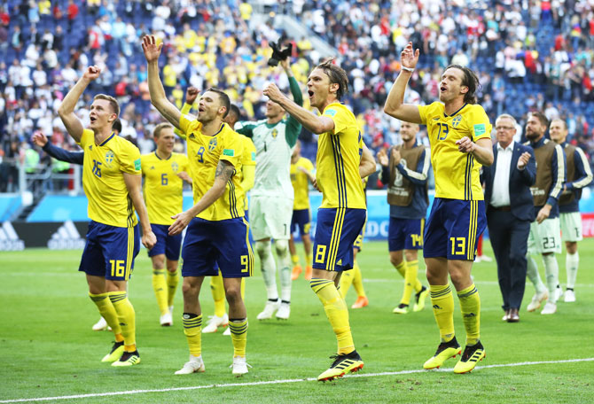 Sweden players celebrate after defeating Switzerland