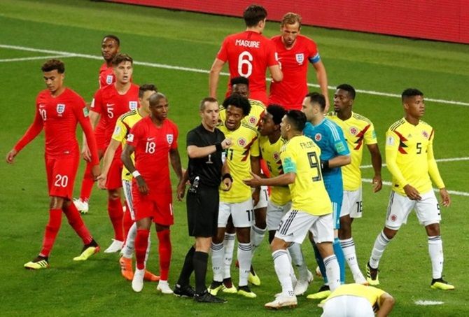  Colombia's Juan Cuadrado and team mates remonstrate with referee Mark Geiger