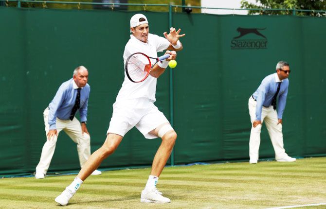 USA's John Isner in action during the second round match against Belgium's Ruben Bemelmans