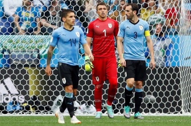 Uruguay's Diego Godin, right, during the quarter-final against France. Photograph: Jason Cairnduff/Reuters