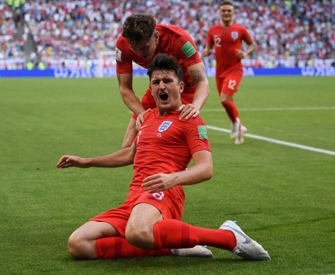 England's Harry Maguire celebrates after scoring his team's first goal against Sweden in the quarter-final. Photograph: Matthias Hangst/Getty Images