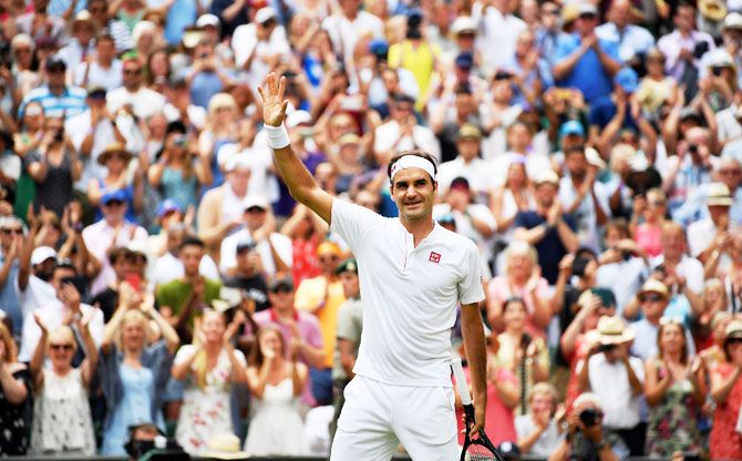Switzerland's Roger Federer celebrates winning his fourth round match against France's Adrian Mannarino