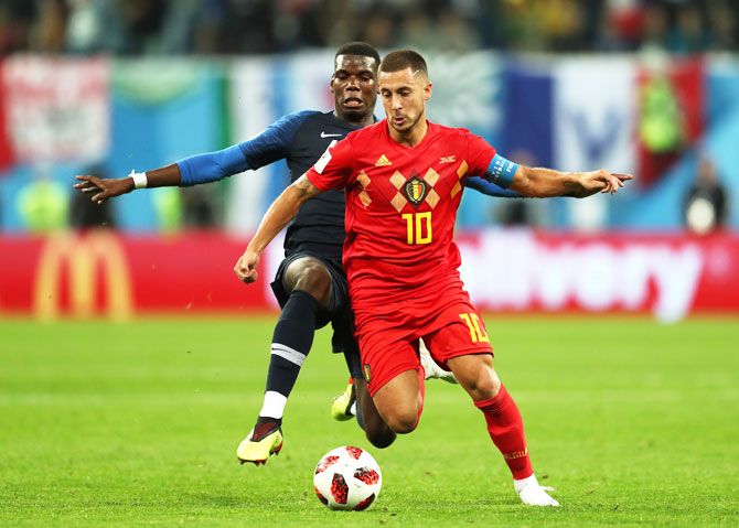 France's Paul Pogba challenges Belgium's Eden Hazard as they vie for possession 