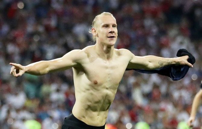 FIFA hit Croatian assistant coach Ognjen Vukojevic with a 15,000-Swiss-franc ($15,000) fine and a warning after he and Croatian defender Domagoj Vida (in pic) said "Glory to Ukraine" in a video posted after Croatia beat Russia in a World Cup quarter-final on Saturday.