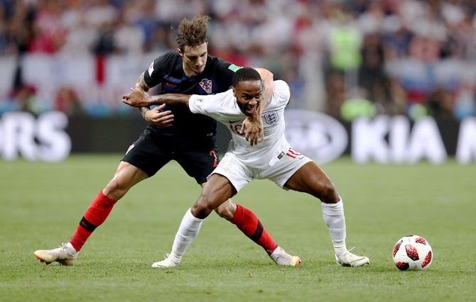 Croatia's Sime Vrsaljko challenges England's Raheem Sterling during the FIFA World Cup semi-final on Wednesday