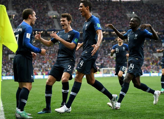  Antoine Griezmann of France celebrates with teammates after the opening goal