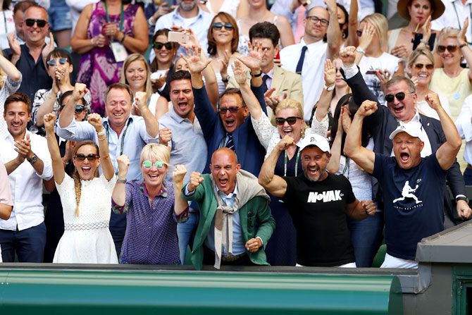 Novak Djokovic's team erupts in celebration after his win