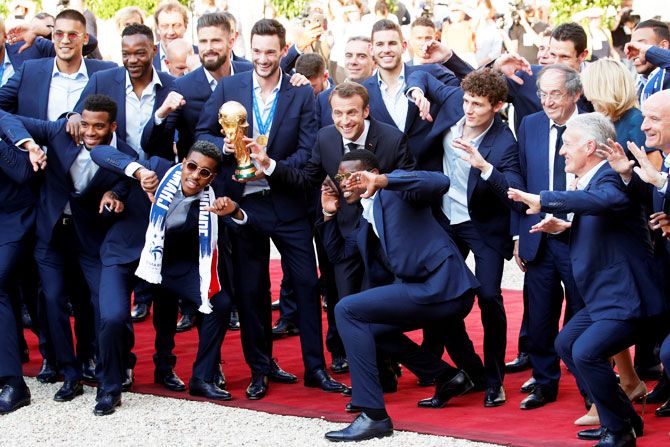 The French World Cup-winning team celebrate with President  Emmanuel Macron on Monday
