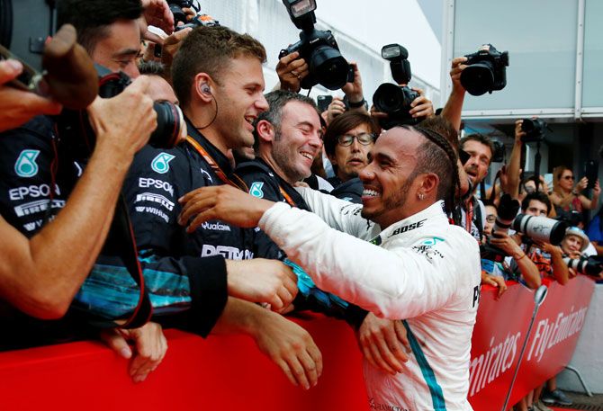 Mercedes' Lewis Hamilton celebrates winning the German GP race with team members at Hockenheimring, Hockenheim, in Germany on Sunday