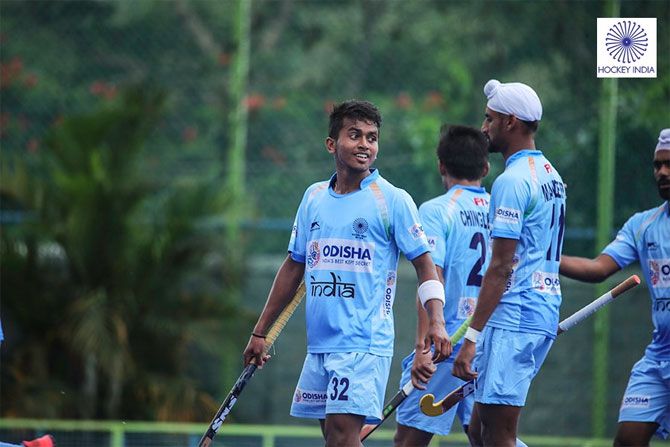 India's hockey players celebrate a goal on Sunday