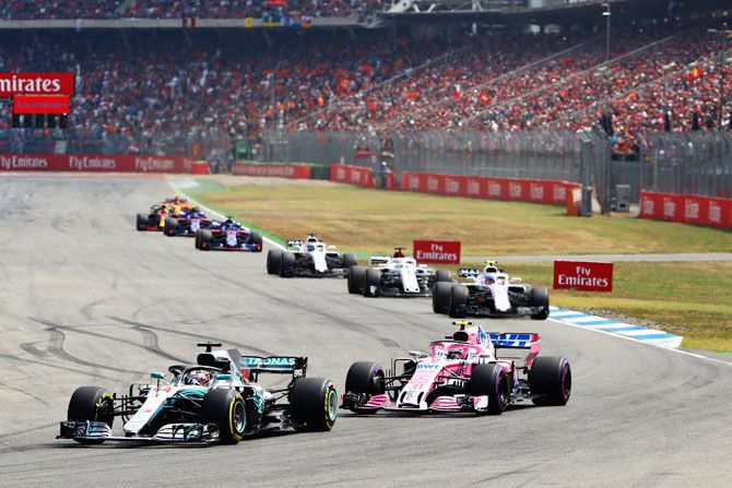 Lewis Hamilton of Great Britain driving the (44) Mercedes AMG Petronas F1 Team Mercedes WO9 leads Sergio Perez of Mexico driving the (11) Sahara Force India F1 Team VJM11 Mercedes on track during the German GP on Sunday