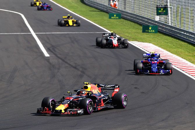 Max Verstappen of the Netherlands driving the (33) Aston Martin Red Bull Racing RB14 TAG Heuer leads Pierre Gasly of France and Scuderia Toro Rosso driving the (10) Scuderia Toro Rosso STR13 Honda on track during the Formula One Grand Prix of Hungary on Sunday