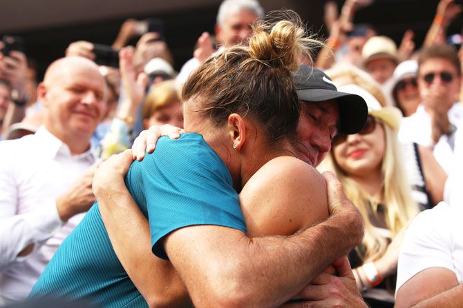Simona Halep hugs her coach Darren Cahill following her victory Saturday
