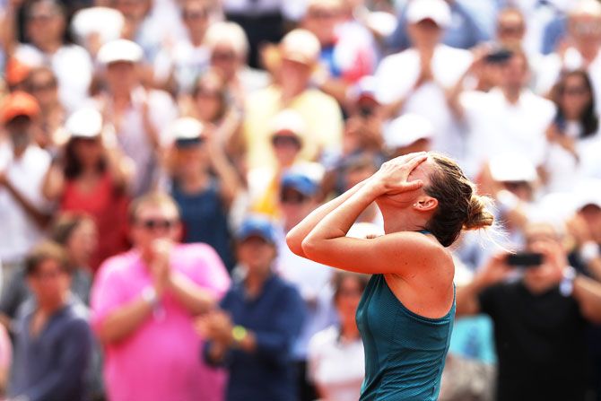 Simona Halep reacts after winning the French Open final on Saturday