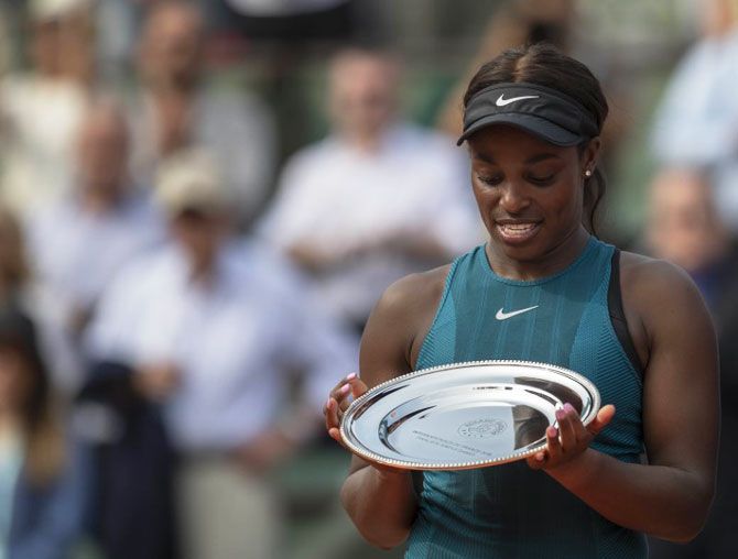 USA's Sloane Stephens with the finalist trophy after her women's final match against Romania's Simona Halep at the 2018 French Open at Roland Garros on Saturday