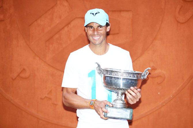 Spain's Rafael Nadal poses with the Musketeers' Cup following his French Open victory over Austria's Dominic Thiem at Roland Garros in Paris on Sunday
