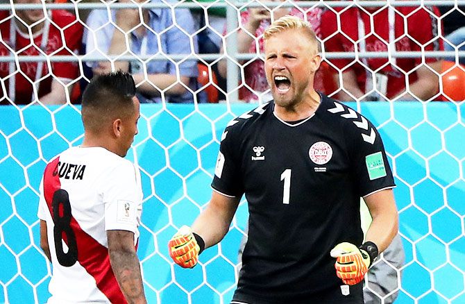 Denmark's Kasper Schmeichel reacts after Peru's Christian Cueva misses a penalty kick 