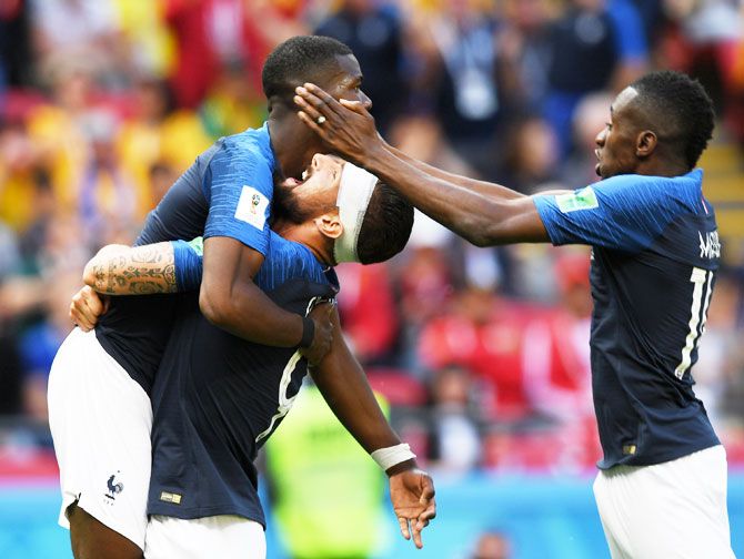 France's Olivier Giroud (right) hoists Paul Pogba after the latter scored his side's second and winning goal against Australia