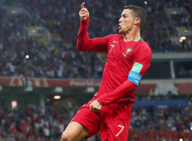 Portugal's Cristiano Ronaldo celebrates scoring his hat-trick against Spain