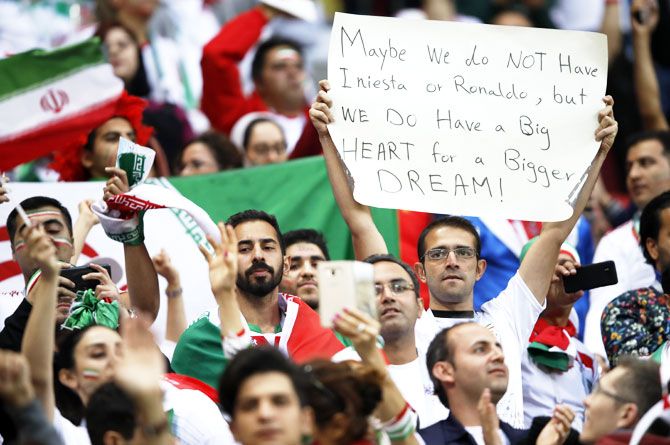 Iran's football supporters speak what's on their mind through this placard during the match against Spain at the Kazan Stadium in Kazan on Wednesday