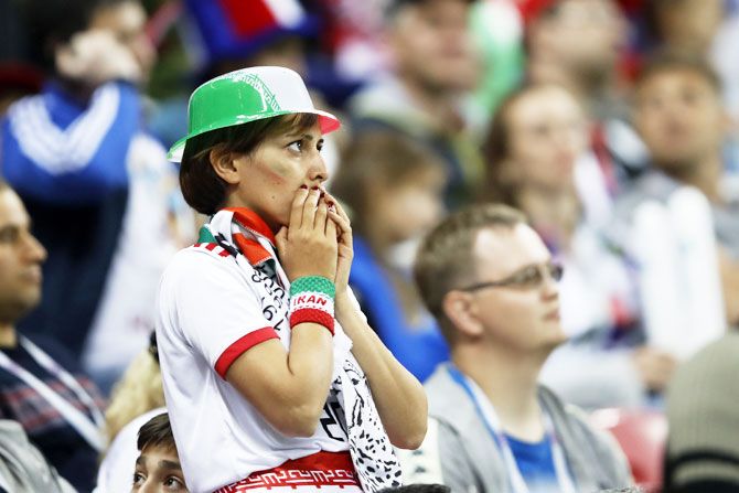 An Iran fan reacts following her team's defeat to Spain on Wednesday