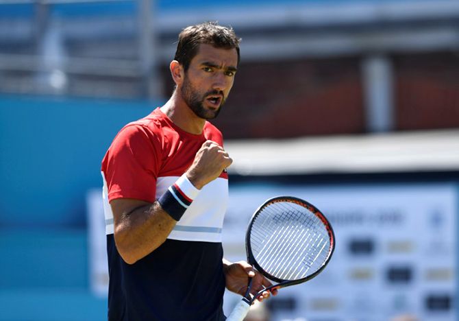 Croatia's Marin Cilic celebrates after winning his quarter-final match against USA's Sam Querrey at the Fever-Tree Championships at The Queen's Club in London on Friday 