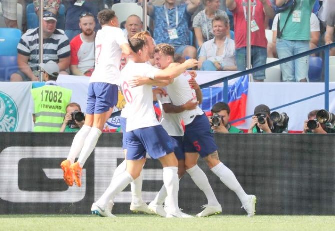 England's John Stones celebrates with teammates after scoring their fourth goal against Panama 