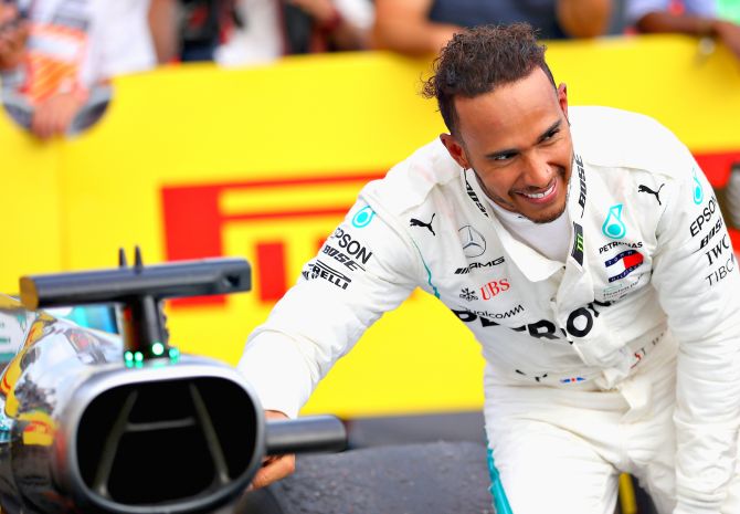 Mercedes GP's British driver Lewis Hamilton celebrates in parc ferme during the Formula One Grand Prix of France at Circuit Paul Ricard in Le Castellet, France, on Sunday