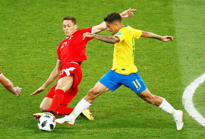 Serbia's Nemanja Matic challenges Brazil's Philippe Coutinho