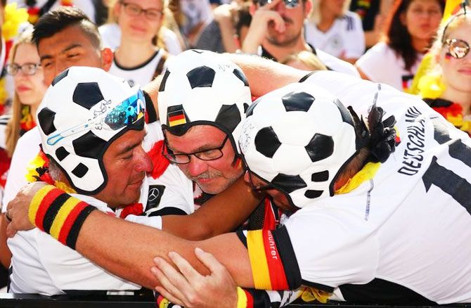 Germany fans react after the match at a public viewing area at Brandenburg Gate in Berlin on Wednesday