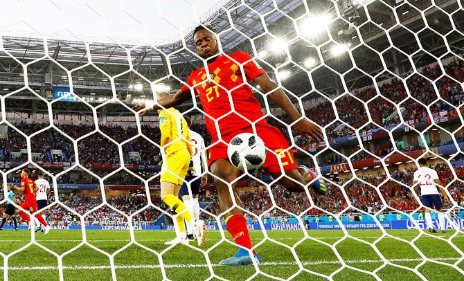 Belgium's Michy Batshuayi kicks the ball in celebration after teammate Adnan Januzaj scores their first goal against England on Thursday