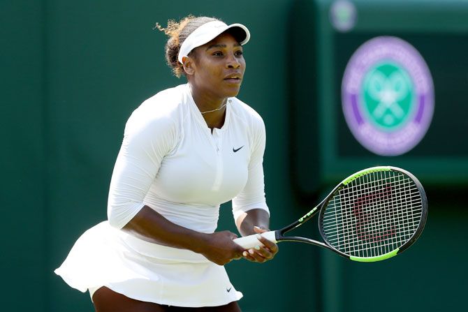 23-time Grand Slam champion Serena Williams practices on court during training for the Wimbledon Lawn Tennis Championships at the All England Lawn Tennis and Croquet Club at Wimbledon in London on Thursday