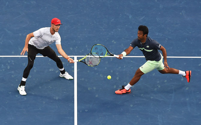 Jamie Cerretani and Leander Paes in action against Jean-Julien Rojer and Horia Tecau during the ATP Dubai Duty Free Tennis Championships men's doubles final at the Dubai Duty Free Stadium in Dubai, United Arab Emirates, on Saturday