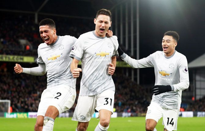 Manchester United's Chris Smalling, Nemanja Matic and Jesse Lingard celebrate the winning goal against Crystal Palace