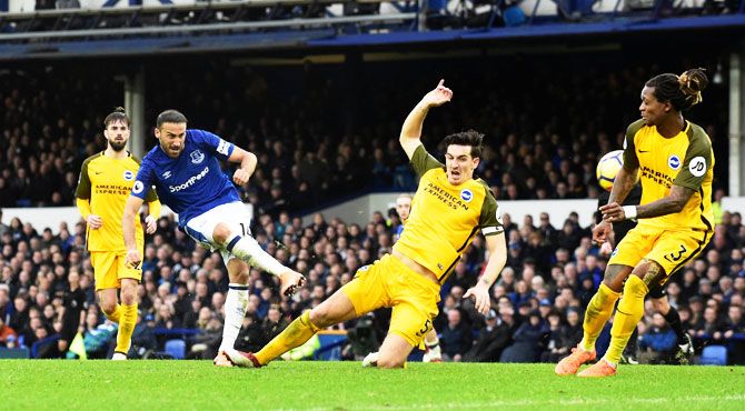 Everton's Cenk Tosun scores their second goal against Brighton & Hove Albion at Goodison Park in Liverpool on Saturday