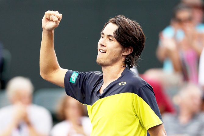 Japan's Taro Daniel celebrates his win over Great Britain's Cameron Noorie during the BNP Paribas Open at the Indian Wells Tennis Garden in Indian Wells, California, on Friday