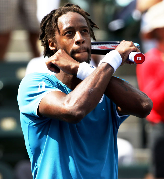 France's Gael Monfils does a Black Panther celebration following his victory over USA's John Isner