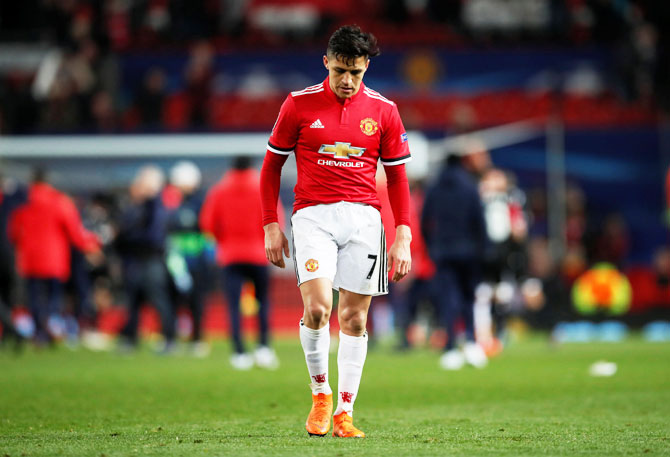 Manchester United’s Alexis Sanchez wears a dejected look after the match