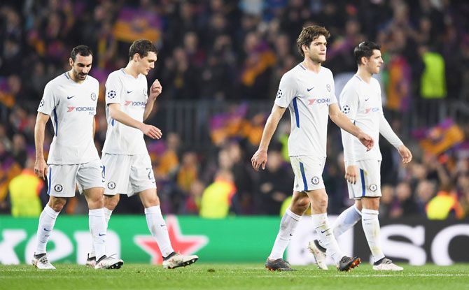 Dejected Chelsea players walk off after losing the match against Barcelona at Nou Camp on Wednesday