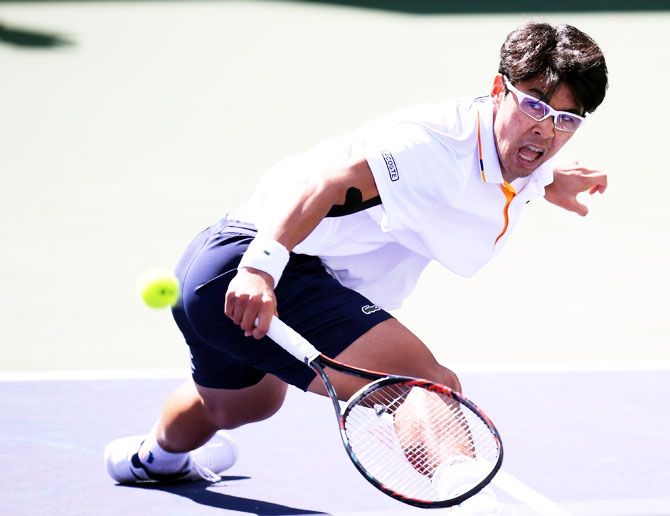 South Korea's Hyeon Chung plays volleys in his match against Uruguay's Pablo Cuevas
