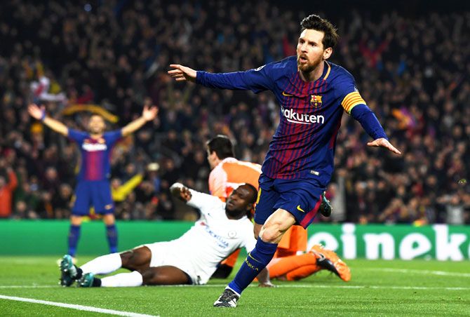 Lionel Messi celebrates on scoring the third goal against Chelsea, his 100th Champions League goal, at Nou Camp in Barcelona on Wednesday, March 14