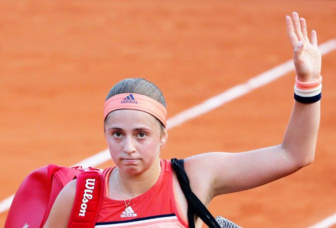 Latvia's Jelena Ostapenko reacts after losing her first round match against Ukraine's Kateryna Kozlova