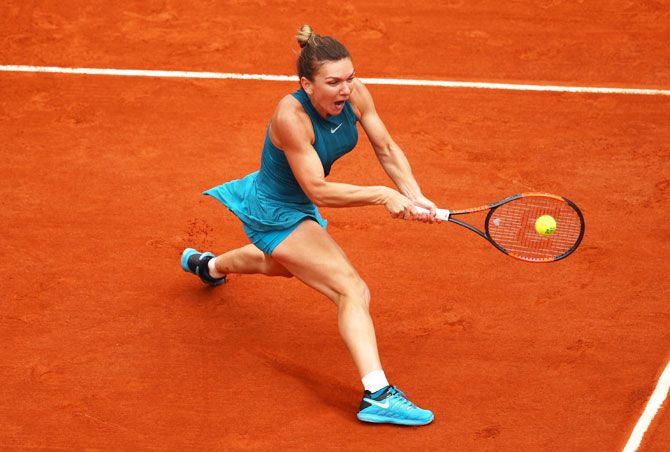 Romania's Simona Halep plays backhand during first round match against United States' Alison Riske