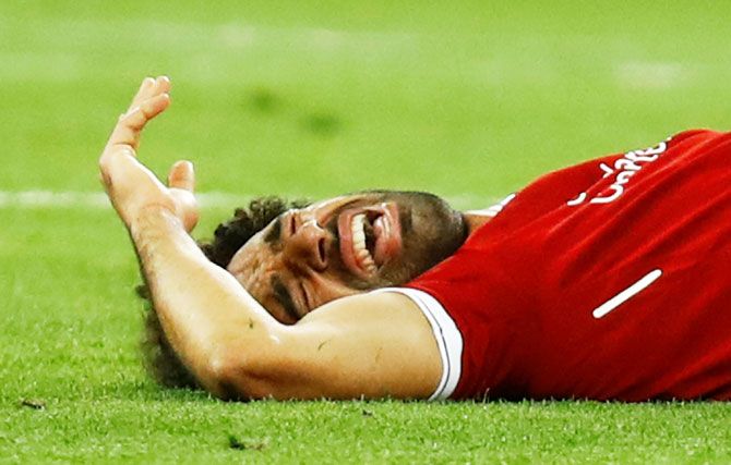 Liverpool's Mohamed Salah reacts after sustaining an injury during the Champions League final against Real Madrid on Saturday