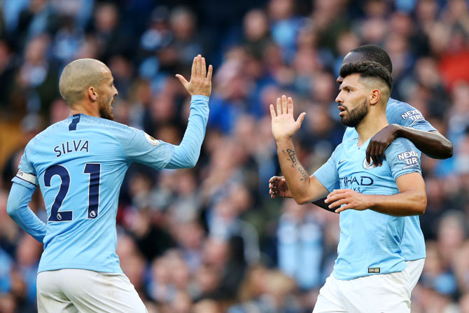 Manchester City's David Silva and Sergio Aguero celebrate after a goal