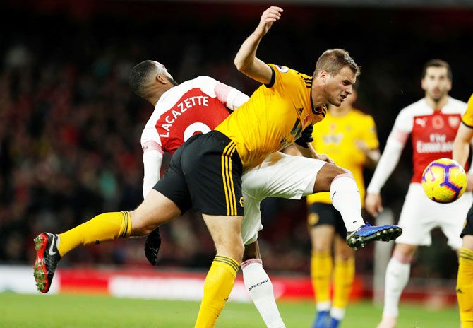 Arsenal's Alexandre Lacazette in action with Wolverhampton Wanderers' Ryan Bennett 