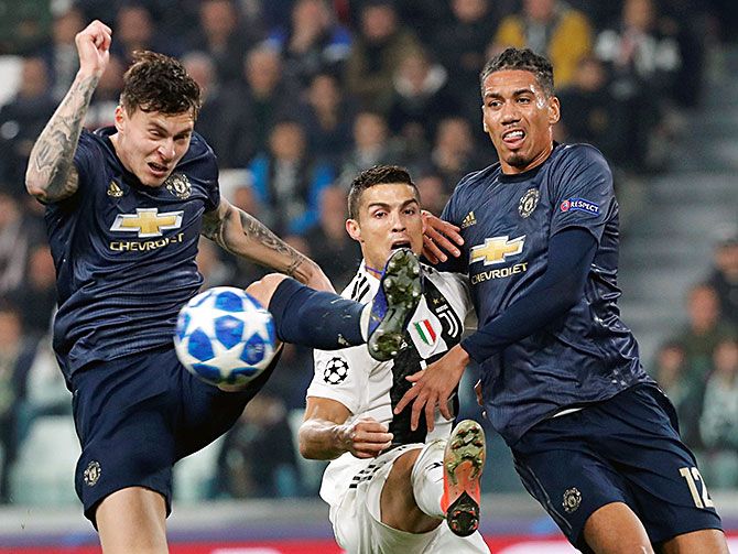  Juventus' Cristiano Ronaldo framed by Manchester United's Victor Lindelof and Chris Smalling in a Champions League game at the Allianz Stadium, Turin, Italy, November 7, 2018. Photograph: Stefano Rellandini/Reuters