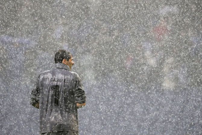 FC Porto's Iker Casillas looks on as the rain beats down on him during the Champions League Group D match against Lokomotiv Moscow at Estadio do Dragao in Porto on November 6